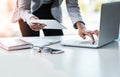 Reading, sending or checking an email or report while at work in at a professional desk. Hands typing on a laptop Royalty Free Stock Photo