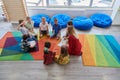 Reading time in an elementary school or kindergarten, a teacher reading a book to children in an elementary school or Royalty Free Stock Photo