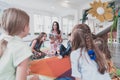 Reading time in an elementary school or kindergarten, a teacher reads a book to children in an elementary school or Royalty Free Stock Photo