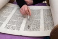 Reading the Torah scroll with the aid of a silver pointer or yad Royalty Free Stock Photo