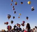 Readington, New Jersey/USA - 7/30/2017: [Festival of Ballooning; Rising Hot Air Balloons Draws Crowds, i.e. Children on Shoulders] Royalty Free Stock Photo