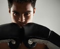 Ready for any newcomers. Portrait of a young male boxer in a fighting stance. Royalty Free Stock Photo