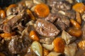 Close up Ready of Beef Burgeoning beef dish in a frying pan. meat, carrots and onions and mushrooms. Appetizing sauce Royalty Free Stock Photo