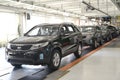 Ready cars stand on the conveyor line of assembly shop. Automobile plant