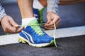 Ready for the challenge. Cropped image of a young man tying his laces before a run. Royalty Free Stock Photo