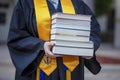 National Honor Society Graduate with Stack of Books
