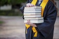 National Honor Society Graduate with Stack of Books