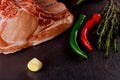 Raw pork chops with herbs and spices on cutting board. Ready for cooking Royalty Free Stock Photo