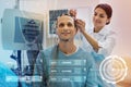 Careful nurse touching the wires while preparing her patient for EEG