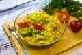 Ready noodles with vegetables and herbs on a wooden board.