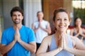 Ready for our yoga class. Portrait of a yoga class in progress. Royalty Free Stock Photo