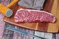 Ready raw fresh steak as wagyu beef  MS 5+ with meat hammer on butcher served  for cooking Royalty Free Stock Photo