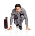 Ready, run and portrait of businessman with briefcase in studio kneeling, confident or prepared on white background Royalty Free Stock Photo