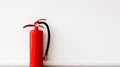 Ready for Safety: Indoor Red Fire Extinguisher on White Wall Royalty Free Stock Photo