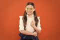 She is ready. school girl in uniform. child with party glasses. smart and intelligent kid on orange background. back to Royalty Free Stock Photo