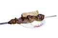 Ready shashlik with onions and bread on a plate