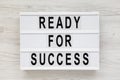`Ready for success` words on a modern board on a white wooden background. Overhead, from above, flat lay Royalty Free Stock Photo