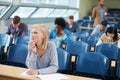 Ready to ace the midterms. university students in a classroom.