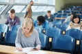 Ready to ace the midterms. university students in a classroom.