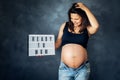 Ready to become a mother concept - pregnancy shooting in studio Royalty Free Stock Photo
