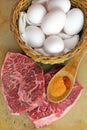 Ready to cook flat iron steak and eggs Royalty Free Stock Photo