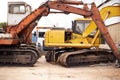 Ready to do some scrapping. cranes in a dumpsite. Royalty Free Stock Photo