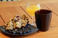 Buttered berry muffin with coffee and orange juice Royalty Free Stock Photo