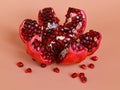 Ready to eat red ripe juicy pomegranate fruit with seeds, healthy eating concept on an orange background Royalty Free Stock Photo