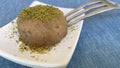 Traditional Turkish un halva dessert with pistachios