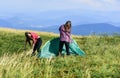 Ready to get refreshed. family camping. reach destination place. hiking outdoor adventure. two girls pitch tent