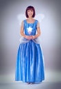 Ready to grant your wishes. A full length shot of a fairy godmother in a blue gown.