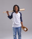 Ready to have a ball. Studio shot of a young boy with baseball gear. Royalty Free Stock Photo