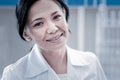 Portrait of charming female doctor smiling into camera Royalty Free Stock Photo