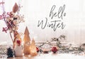 Ready to postcard Hello Winter. Christmas festive decor still life on wooden background, concept of home comfort and holiday