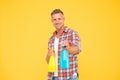 Ready to spray. Happy man hold spray bottles yellow background. Spray cleaning. Trigger sprayer dispensers. Spray wash Royalty Free Stock Photo