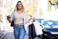 Ready to take over the fashion world. a young woman enjoying a day of shopping. Royalty Free Stock Photo