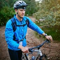 Ready to take on the trail. a male cyclist out for a ride on his mountain bike. Royalty Free Stock Photo