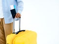 Ready to trip. Passport with flight ticket in young man`s hand in jeans shirt while walking.