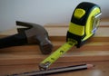Home Improvement Tools - Hammer, Tape Measure, and Boards