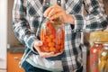 I am ready for winter season, person hand holding the pickled tomatoes and cucumbers in jar Royalty Free Stock Photo