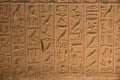 Real ancient hieroglyphics in stone at exhibition Gods of Egypt.