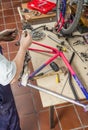 Real bicycle mechanic cleaning bike parts Royalty Free Stock Photo