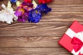 Real box with white and red bow and ribbon top view on Valentine`s day  on wooden background. Flat lay Copy space Royalty Free Stock Photo