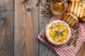 A real Camembert from France with thyme, honey and toasted bread on old wooden rustic table. Soft cheese on a wooden background wi Royalty Free Stock Photo