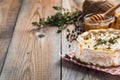 A real Camembert from France with thyme, honey and toasted bread on old wooden rustic table. Soft cheese on a wooden background wi Royalty Free Stock Photo