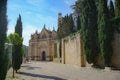 Real Colegiata de Santa Maria la Mayor church surrounded by trees on a scenic street, Spain Royalty Free Stock Photo