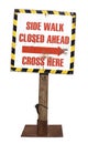 Real Construction Sign on a Wooden and Metal Stand, isolated cutout on white background