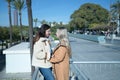 Real couple of young women, holding hands, looking at each other and talking in affectionate attitude. Concept lgtbiq+, lesbians, Royalty Free Stock Photo