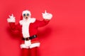 Real, crazy Santa Claus in funny sunglasses posing