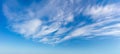 Real day sky - real blue sky during daytime with white light clouds Freedom and peace. Large photo format Panoramic. Cloudscape Royalty Free Stock Photo